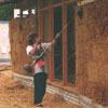Trimming down the straw bales